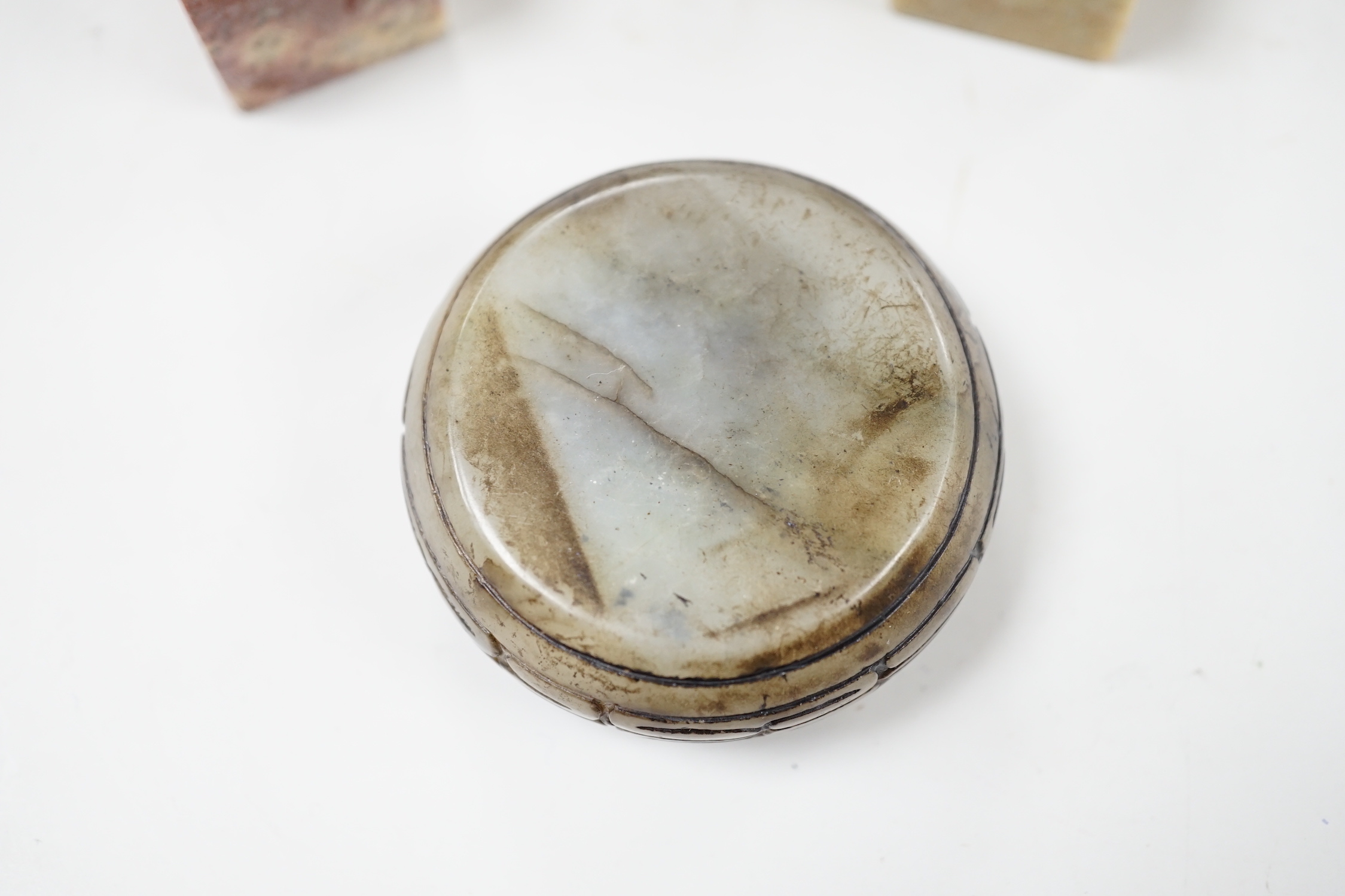 Two Chinese soapstone seals, a jade bowl, and a tea bowl, tea bowl 6.5cm diameter